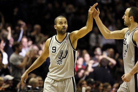 Dec 29, 2013; San Antonio, TX, USA; San Antonio Spurs guard Tony Parker (9) celebrates a score with Manu Ginobili (right) during the second Dec 29, 2013; San Antonio, TX, USA; San Antonio Spurs guard Tony Parker (9) celebrates a score with Manu Ginobili (right) during the second