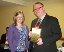 Melissa A. Broeckelman-Post, chair of the Basic Course Division Program of Excellence Award Committee, presents the National Communication Association's 2013 Program of Excellence award to Joshua Westwick, SDSU Assistant Professor. (SDSU.edu) Melissa A. Broeckelman-Post, chair of the Basic Course Division Program of Excellence Award Committee, presents the National Communication Association's 2013 Program of Excellence award to Joshua Westwick, SDSU Assistant Professor. (SDSU.edu)