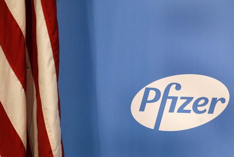 The Pfizer logo is seen next to a U.S. flag in a conference room at their world headquarters in New York November 5, 2013. REUTERS/Adam Hung The Pfizer logo is seen next to a U.S. flag in a conference room at their world headquarters in New York November 5, 2013. REUTERS/Adam Hung