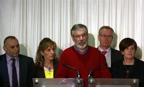 Sinn Fein President Gerry Adams (C) and party colleagues speak to the media in Belfast following the end of talks to resolve divisive issues Sinn Fein President Gerry Adams (C) and party colleagues speak to the media in Belfast following the end of talks to resolve divisive issues