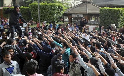 Cairo University students supporting the Muslim Brotherhood and deposed President Mohamed Mursi shout slogans at the university's campus in Cairo University students supporting the Muslim Brotherhood and deposed President Mohamed Mursi shout slogans at the university's campus in