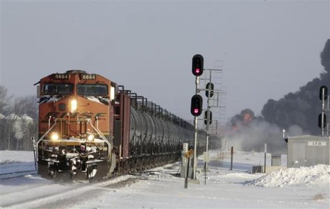 A plume of smoke rises from scene of a derailed train near Casselton, North Dakota December 30, 2013.
CREDIT: REUTERS/MICHAEL VOSBURG/FORUM NEWS SERVICE A plume of smoke rises from scene of a derailed train near Casselton, North Dakota December 30, 2013.
CREDIT: REUTERS/MICHAEL VOSBURG/FORUM NEWS SERVICE