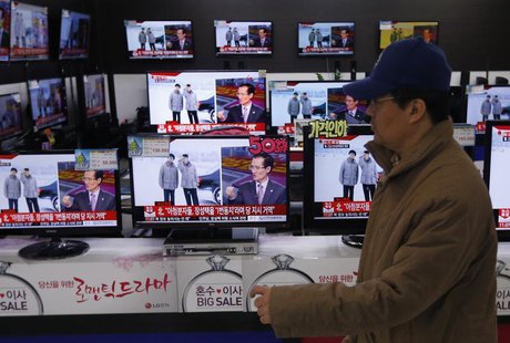 A man walks past televisions showing reports on the execution of Jang Song Thaek, who is North Korean leader Kim Jong Un's uncle, at an elec A man walks past televisions showing reports on the execution of Jang Song Thaek, who is North Korean leader Kim Jong Un's uncle, at an elec