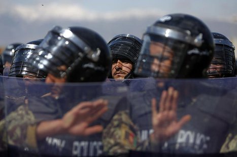 Afghan military policemen stand guard during a ceremony handing over the Bagram prison to Afghan authorities, at the U.S. airbase in Bagram, Afghan military policemen stand guard during a ceremony handing over the Bagram prison to Afghan authorities, at the U.S. airbase in Bagram,
