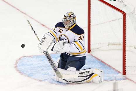 Buffalo Sabres goalie Ryan Miller (30) deflects the puck during the first period against the New York Rangers at Madison Square Garden. Mand Buffalo Sabres goalie Ryan Miller (30) deflects the puck during the first period against the New York Rangers at Madison Square Garden. Mand
