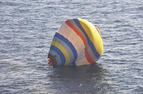 A hot-air balloon drifting on the ocean is seen in the East China Sea near the disputed isles known as Senkaku isles in Japan and Diaoyu isl A hot-air balloon drifting on the ocean is seen in the East China Sea near the disputed isles known as Senkaku isles in Japan and Diaoyu isl