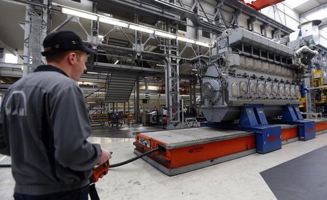 Workers assemble a large Diesel engine at the MAN Diesel & Turbo factory in Augsburg March 6, 2013. REUTERS/Michael Dalder Workers assemble a large Diesel engine at the MAN Diesel & Turbo factory in Augsburg March 6, 2013. REUTERS/Michael Dalder
