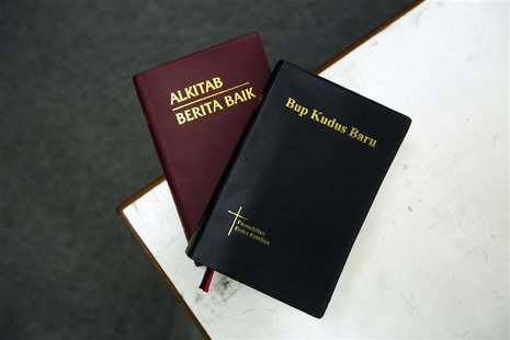 Two copies of the Bible in Malay (L) and the Iban dialect are seen in this picture illustration taken in Kuala Lumpur January 2, 2014. REUTE Two copies of the Bible in Malay (L) and the Iban dialect are seen in this picture illustration taken in Kuala Lumpur January 2, 2014. REUTE