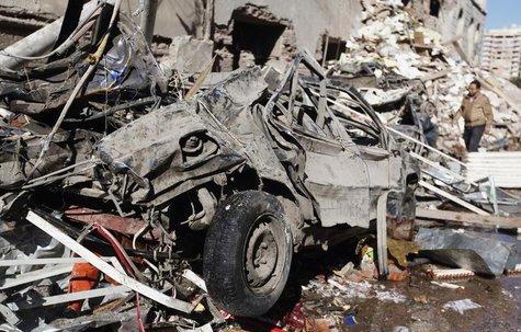 A man walks near debris after an explosion near security building in Egypt's Nile Delta city of Mansoura in Dakahlyia province, about 120 km A man walks near debris after an explosion near security building in Egypt's Nile Delta city of Mansoura in Dakahlyia province, about 120 km