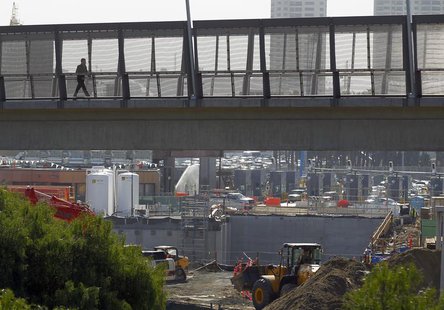 A pedestrian walks over a large construction project for U.S. Customs at the San Ysidro border crossing into the United States in San Ysidro A pedestrian walks over a large construction project for U.S. Customs at the San Ysidro border crossing into the United States in San Ysidro