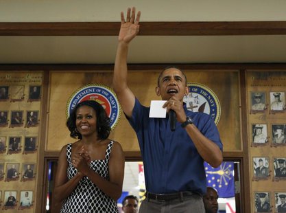 U.S. President Barack Obama (R) and first lady Michelle Obama greet military personnel during a Christmas day visit to Marine Corps Base Haw U.S. President Barack Obama (R) and first lady Michelle Obama greet military personnel during a Christmas day visit to Marine Corps Base Haw