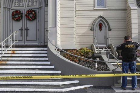 Eureka Police investigate the murder of Reverend Eric Freed outside of St. Bernard Church in Eureka, California on January 1, 2014. REUTERS/ Eureka Police investigate the murder of Reverend Eric Freed outside of St. Bernard Church in Eureka, California on January 1, 2014. REUTERS/