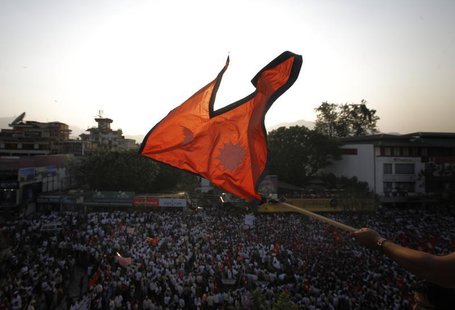 The national flag of Nepal is waved during a mass gathering in Kathmandu May 23, 2012. REUTERS/Navesh Chitrakar The national flag of Nepal is waved during a mass gathering in Kathmandu May 23, 2012. REUTERS/Navesh Chitrakar