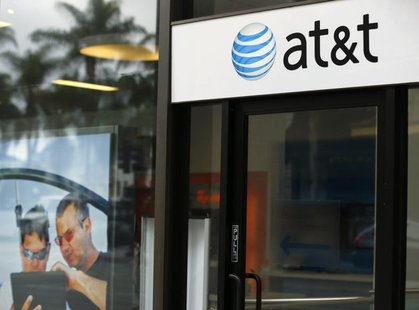An AT&T wireless store front is pictured in in San Diego, California October 23, 2013. REUTERS/Mike Blake An AT&T wireless store front is pictured in in San Diego, California October 23, 2013. REUTERS/Mike Blake