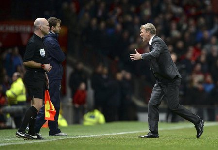 Manchester United manager David Moyes (R) runs onto the pitch as he appeals for a penalty for his player Ashley Young during their English P Manchester United manager David Moyes (R) runs onto the pitch as he appeals for a penalty for his player Ashley Young during their English P