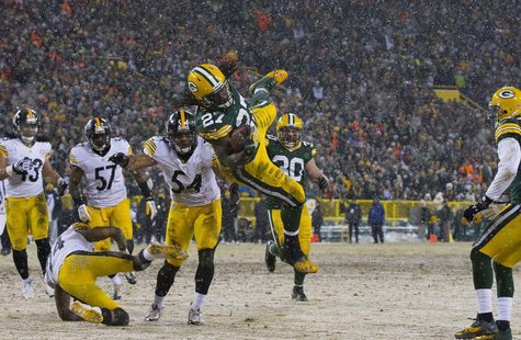Green Bay Packers running back Eddie Lacy (27) leaps for a touchdown during the first quarter against the Pittsburgh Steelers at Lambeau Fie Green Bay Packers running back Eddie Lacy (27) leaps for a touchdown during the first quarter against the Pittsburgh Steelers at Lambeau Fie