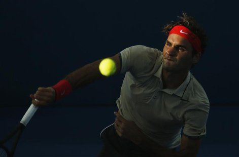 Roger Federer of Switzerland serves to Jeremy Chardy of France during their men's singles semi-final match at the Brisbane International ten Roger Federer of Switzerland serves to Jeremy Chardy of France during their men's singles semi-final match at the Brisbane International ten
