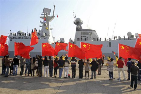 Chinese nationals living in Cyprus wave Chinese national flags as the Chinese frigate Yancheng comes in to dock at Limassol port, January 4, Chinese nationals living in Cyprus wave Chinese national flags as the Chinese frigate Yancheng comes in to dock at Limassol port, January 4,