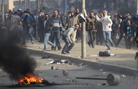 Supporters of Muslim Brotherhood and ousted Egyptian President Mohamed Mursi clash with riot police during clashes at Nasr City district in Supporters of Muslim Brotherhood and ousted Egyptian President Mohamed Mursi clash with riot police during clashes at Nasr City district in