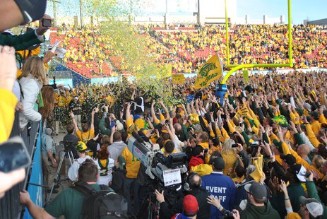 Fans cheer on the NDSU Bison after they stormed the field following the Bison's 3rd straight FCS National Championship January 4th, 2014. Fans cheer on the NDSU Bison after they stormed the field following the Bison's 3rd straight FCS National Championship January 4th, 2014.
