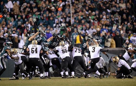 Jan 4, 2014; Philadelphia, PA, USA; New Orleans Saints kicker Shayne Graham (3) kicks the game-winning field goal against the Philadelphia E Jan 4, 2014; Philadelphia, PA, USA; New Orleans Saints kicker Shayne Graham (3) kicks the game-winning field goal against the Philadelphia E