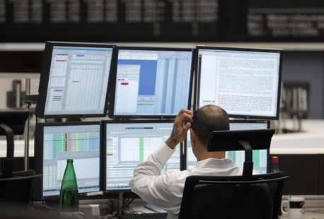 A trader reacts at his desk at the Frankfurt stock exchange August 19, 2011. REUTERS/Alex Domanski A trader reacts at his desk at the Frankfurt stock exchange August 19, 2011. REUTERS/Alex Domanski