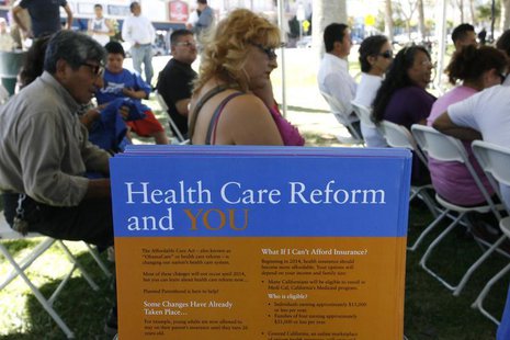People gather for information during a Planned Parenthood Affordable Care Act outreach event for the Latino community in Los Angeles, Califo People gather for information during a Planned Parenthood Affordable Care Act outreach event for the Latino community in Los Angeles, Califo