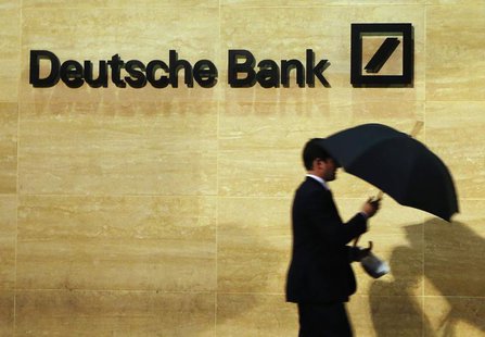 A man walks past Deutsche Bank offices in London December 5, 2013. REUTERS/Luke MacGregor A man walks past Deutsche Bank offices in London December 5, 2013. REUTERS/Luke MacGregor