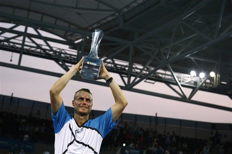 Lleyton Hewitt of Australia holds the Brisbane International men's singles trophy after defeating Roger Federer of Switzerland in Brisbane, Lleyton Hewitt of Australia holds the Brisbane International men's singles trophy after defeating Roger Federer of Switzerland in Brisbane,