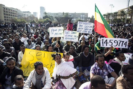 African migrants hold signs during a protest at Rabin Square in Tel Aviv January 5, 2014. REUTERS/Nir Elias African migrants hold signs during a protest at Rabin Square in Tel Aviv January 5, 2014. REUTERS/Nir Elias