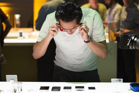 A man uses Google Glass to photograph examples of Motorola's new Moto X phone next to other mobile phones at a launch event in New York, Aug A man uses Google Glass to photograph examples of Motorola's new Moto X phone next to other mobile phones at a launch event in New York, Aug