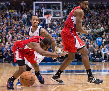 Jan 3, 2014; Dallas, TX, USA; Los Angeles Clippers point guard Chris Paul (3) falls to the court while dribbling past Dallas Mavericks shoot Jan 3, 2014; Dallas, TX, USA; Los Angeles Clippers point guard Chris Paul (3) falls to the court while dribbling past Dallas Mavericks shoot