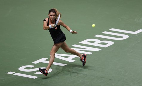 Agnieszka Radwanska of Poland hits a return to Angelique Kerber of Germany during their WTA tennis championships match at Sinan Erdem Dome i Agnieszka Radwanska of Poland hits a return to Angelique Kerber of Germany during their WTA tennis championships match at Sinan Erdem Dome i