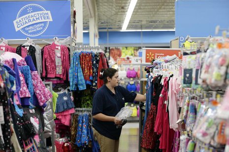 A worker stocks merchandise at the Wal-Mart Superstore in the Porter Ranch section of Los Angeles November 26, 2013. REUTERS/Kevork Djansezi A worker stocks merchandise at the Wal-Mart Superstore in the Porter Ranch section of Los Angeles November 26, 2013. REUTERS/Kevork Djansezi