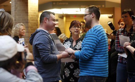Isaac Troyo (L) and his partner Jed Mecham get married at the Salt Lake County Government Building in Salt Lake City, Utah, December 23, 201 Isaac Troyo (L) and his partner Jed Mecham get married at the Salt Lake County Government Building in Salt Lake City, Utah, December 23, 201