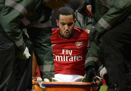 Arsenal's Theo Walcott is stretchered off the pitch during their English FA Cup soccer match against Tottenham Hotspur at the Emirates stadi Arsenal's Theo Walcott is stretchered off the pitch during their English FA Cup soccer match against Tottenham Hotspur at the Emirates stadi