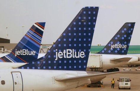 JetBlue Airways aircraft are pictured at departure gates at John F. Kennedy International Airport in New York June 15, 2013. REUTERS/Fred Pr JetBlue Airways aircraft are pictured at departure gates at John F. Kennedy International Airport in New York June 15, 2013. REUTERS/Fred Pr