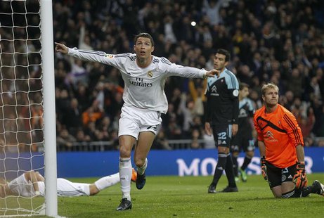 Real Madrid's Cristiano Ronaldo (C) celebrates his goal against Celta Vigo during their Spanish First Division soccer match at Santiago Bern Real Madrid's Cristiano Ronaldo (C) celebrates his goal against Celta Vigo during their Spanish First Division soccer match at Santiago Bern