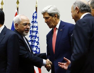 U.S. Secretary of State John Kerry (R) shakes hands with Iranian Foreign Minister Mohammad Javad Zarif after a ceremony at the United Nation U.S. Secretary of State John Kerry (R) shakes hands with Iranian Foreign Minister Mohammad Javad Zarif after a ceremony at the United Nation