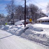 A car is covered in snow. A car is covered in snow.