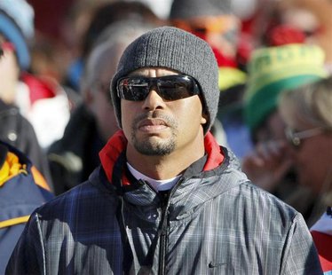 Golfer Tiger Woods of the U.S. watches the Women's World Cup Downhill skiing race in Val d'Isere, French Alps, December 21, 2013. REUTERS/Ro Golfer Tiger Woods of the U.S. watches the Women's World Cup Downhill skiing race in Val d'Isere, French Alps, December 21, 2013. REUTERS/Ro