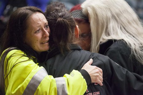 Tina Shay (L) and others react after hearing that a union vote narrowly passed by 51% in support of Boeing's contract with the International Tina Shay (L) and others react after hearing that a union vote narrowly passed by 51% in support of Boeing's contract with the International
