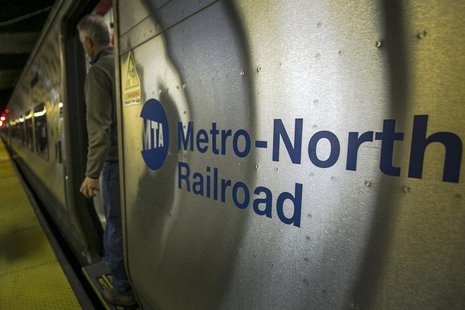 A morning commuter exits a Metro-North Hudson line train at Grand Central Station in New York December 4, 2013. REUTERS/Brendan McDermid A morning commuter exits a Metro-North Hudson line train at Grand Central Station in New York December 4, 2013. REUTERS/Brendan McDermid