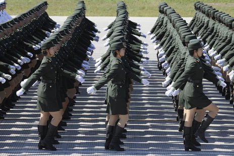 Female soldiers from the Chinese People's Liberation Army (PLA) Ground Force march in formation during a training session at the 60th Nation Female soldiers from the Chinese People's Liberation Army (PLA) Ground Force march in formation during a training session at the 60th Nation