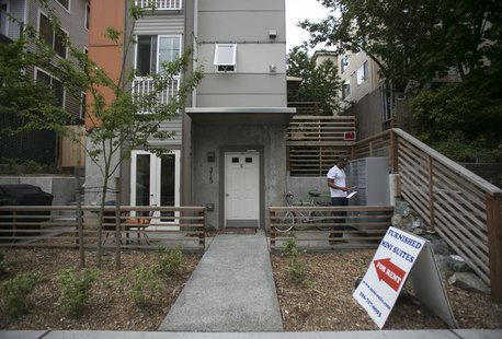 Jon-Christian Stubblefield checks his mail outside of his Mini-Suite apartment building in the First Hill neighborhood in Seattle, Washingto Jon-Christian Stubblefield checks his mail outside of his Mini-Suite apartment building in the First Hill neighborhood in Seattle, Washingto