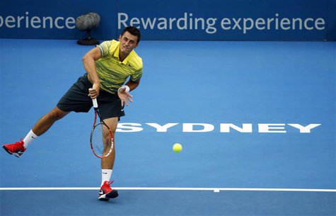 Bernard Tomic of Australia serves to Marcel Granollers of France during their first round match at the Sydney International tennis tournamen Bernard Tomic of Australia serves to Marcel Granollers of France during their first round match at the Sydney International tennis tournamen
