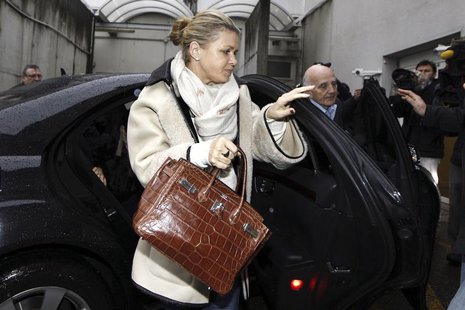 Corinna Schumacher (L), wife of former Formula One world champion Michael Schumacher, and Professor Gerard Saillant (R), president of the In Corinna Schumacher (L), wife of former Formula One world champion Michael Schumacher, and Professor Gerard Saillant (R), president of the In