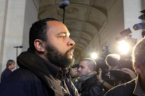 French humorist Dieudonne M'bala M'bala (L), also known as Dieudonne, arrives for the start of the trial of Ilich Ramirez Sanchez, known as French humorist Dieudonne M'bala M'bala (L), also known as Dieudonne, arrives for the start of the trial of Ilich Ramirez Sanchez, known as