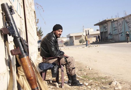 A rebel fighter guards a street to prevent members of the al Qaeda-affiliated Islamic State of Iraq and the Levant (ISIL) from entering Jaba A rebel fighter guards a street to prevent members of the al Qaeda-affiliated Islamic State of Iraq and the Levant (ISIL) from entering Jaba
