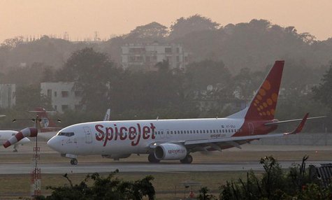 A SpiceJet Boeing 737-800 aircraft taxis on the tarmac after landing at Chhatrapati Shivaji international airport in Mumbai November 26, 201 A SpiceJet Boeing 737-800 aircraft taxis on the tarmac after landing at Chhatrapati Shivaji international airport in Mumbai November 26, 201